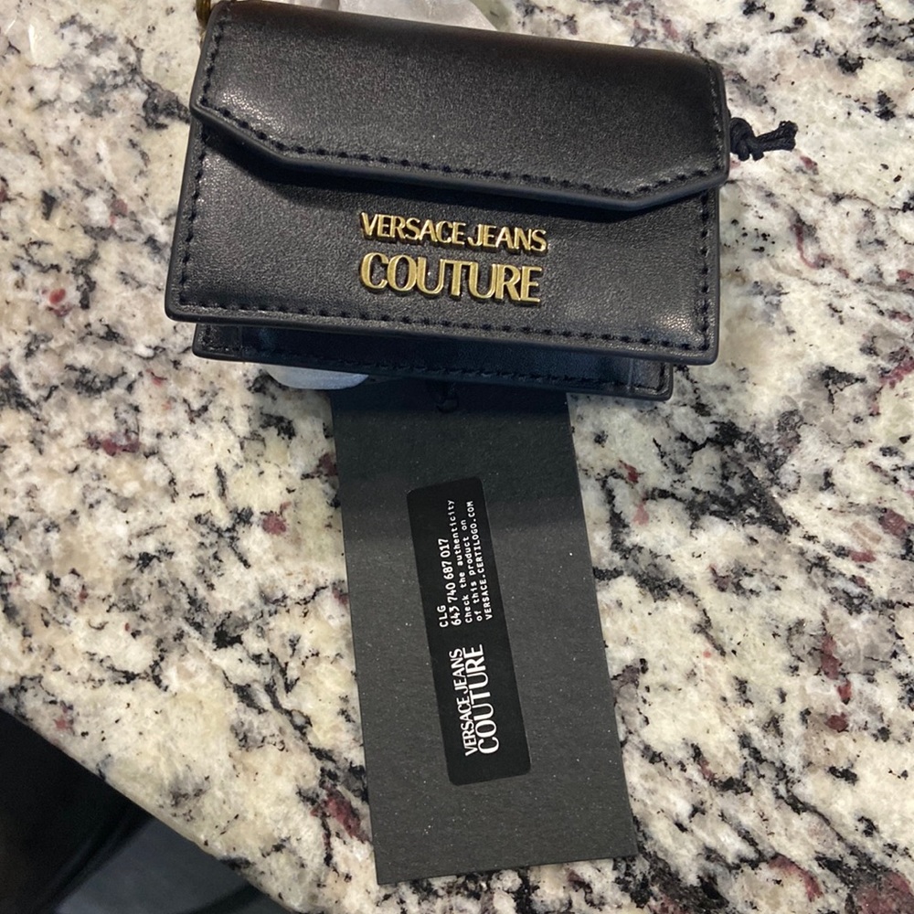 Versace purse that can turn into a crossbody purse.